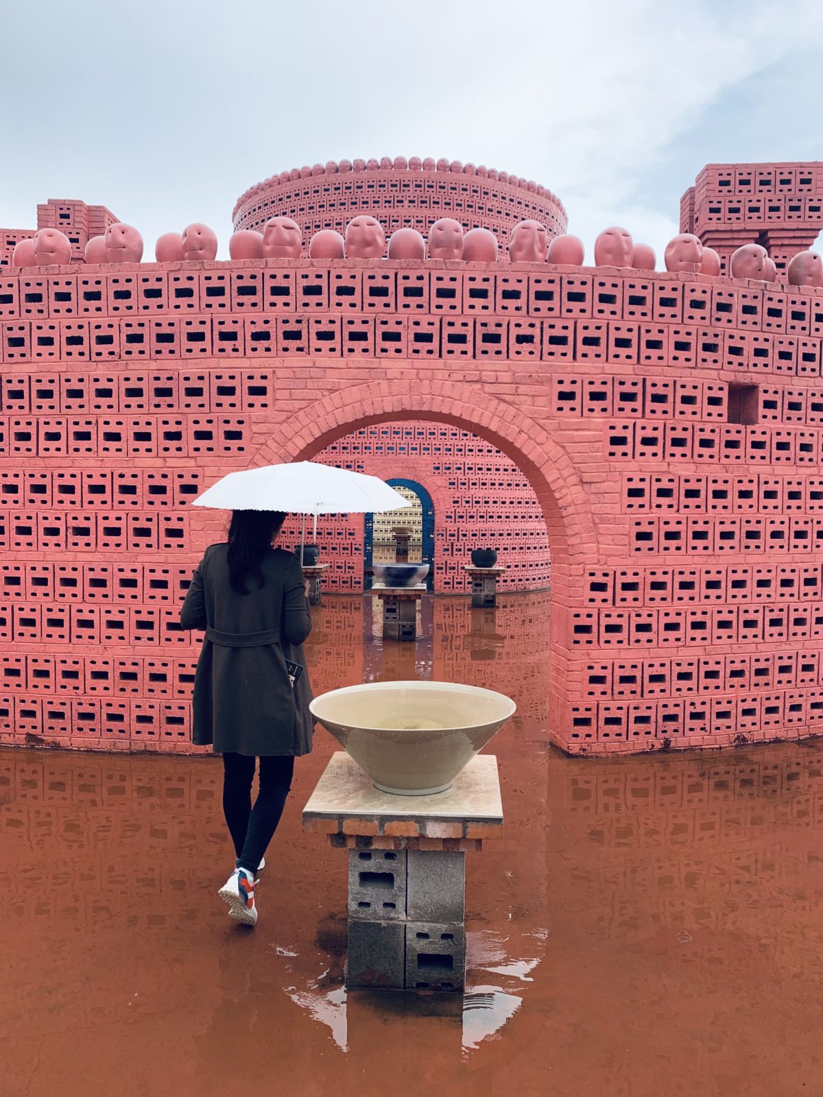 Pink architectural building at The Ant Workshop by Luo Xu, The Ant Workshop in Yunnan